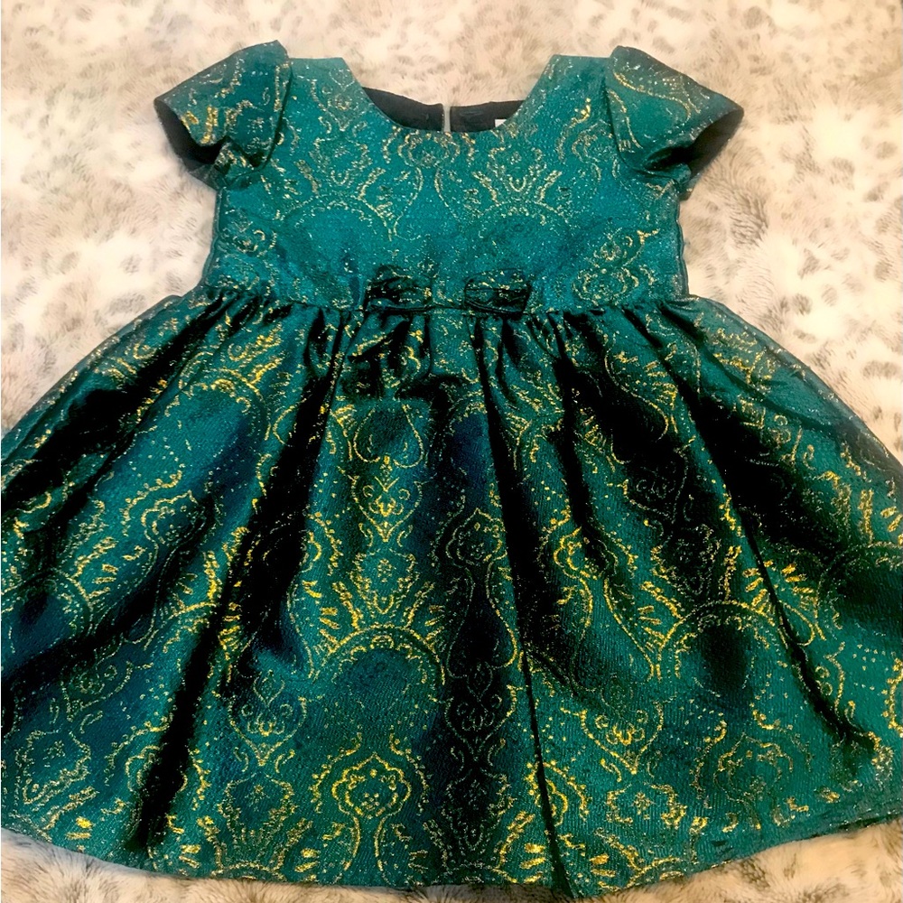 Little girls green holiday dress which is sure to please!